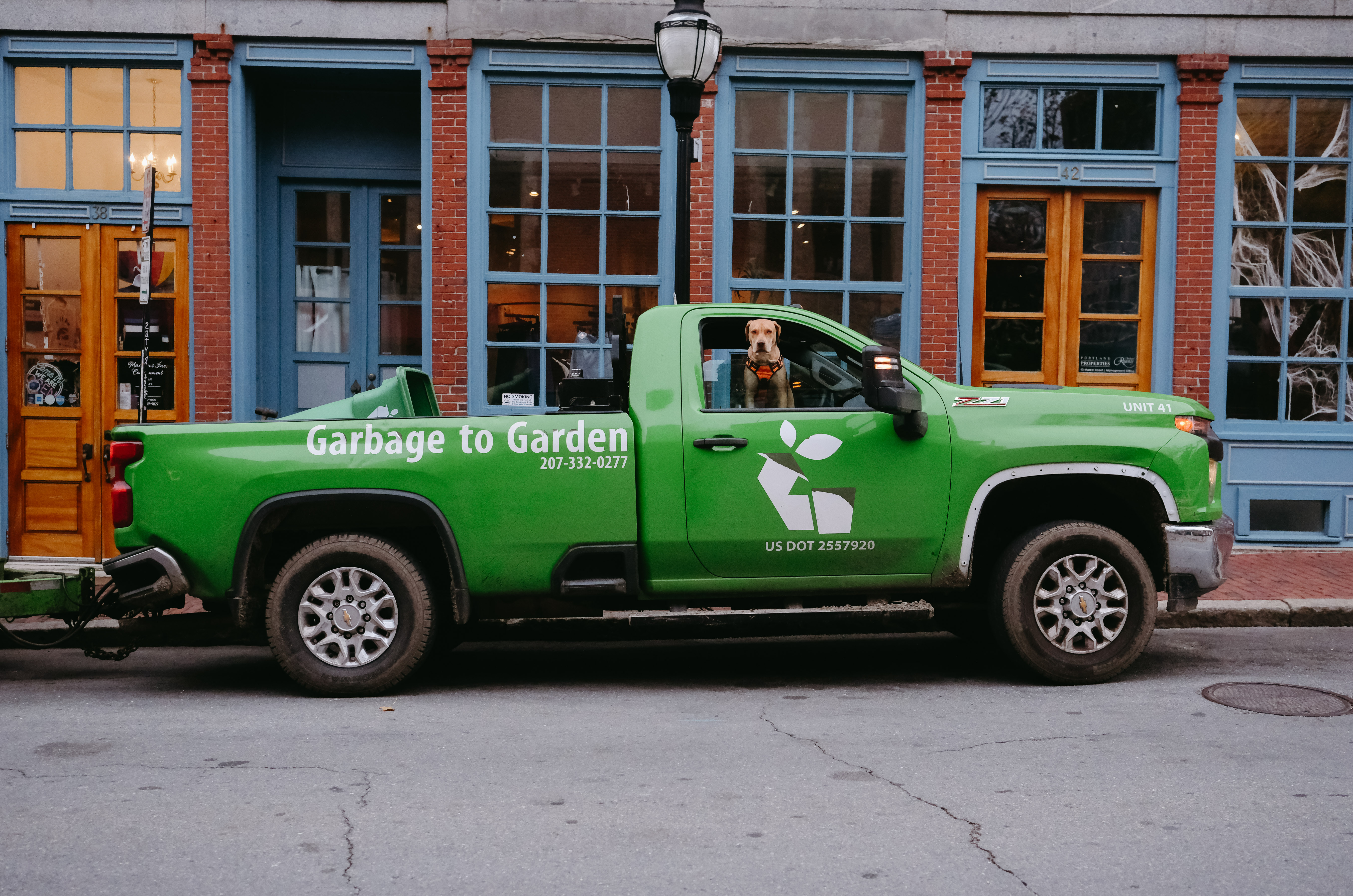 Garbage to Garden truck providing curbside pickup service in neighborhood