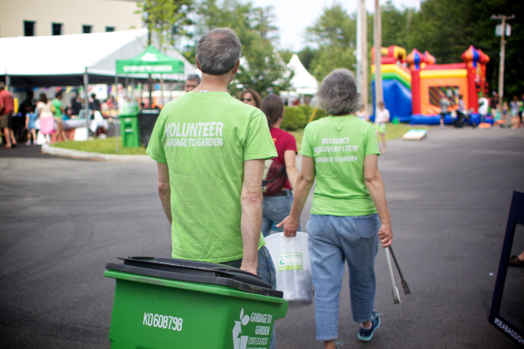 Garbage to Garden volunteers and team members engaged in community composting outreach activities in Portland, Maine